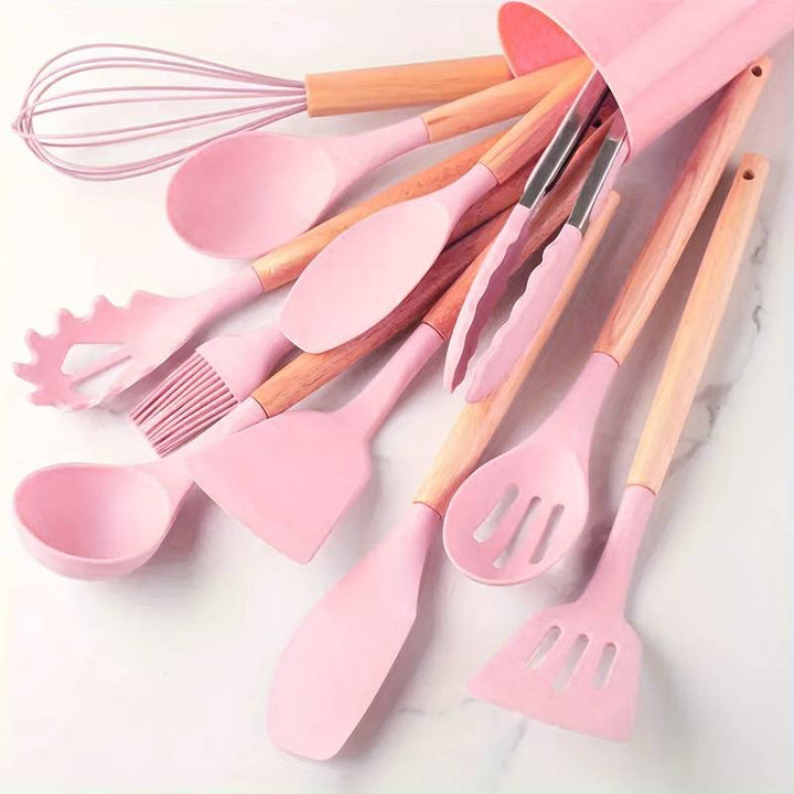 Modern pastel colored silicone cooking utensils in a matching holder