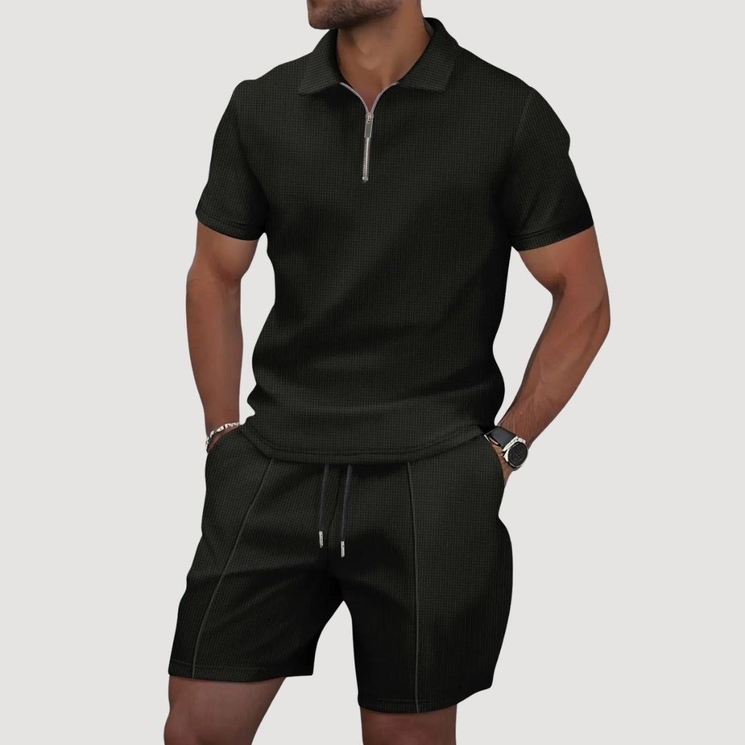 Man wearing black textured polo and shorts two-piece set