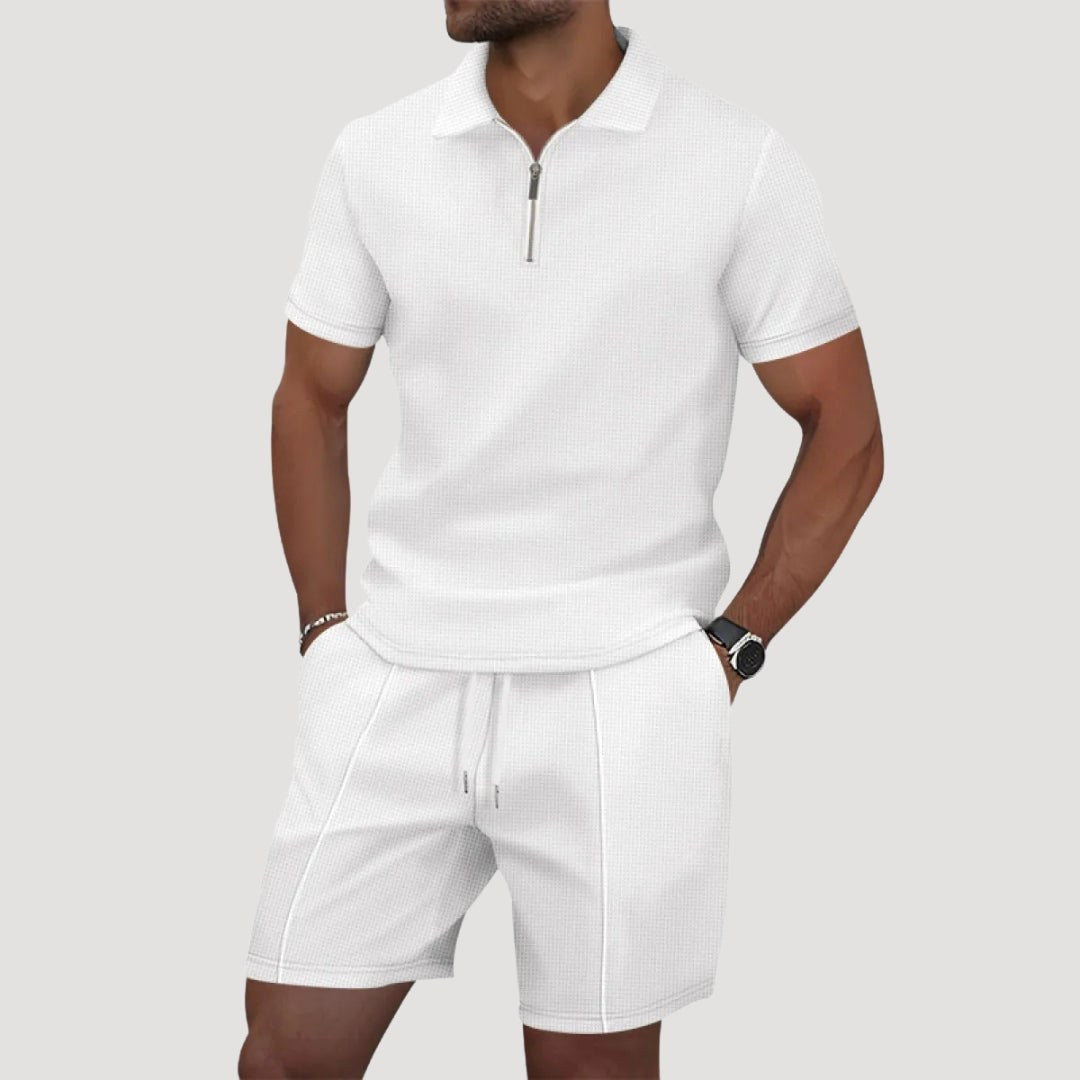 Man wearing white textured polo and shorts two-piece set