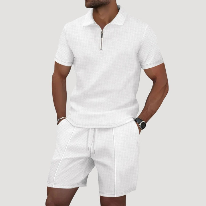 Man wearing white textured polo and shorts two-piece set