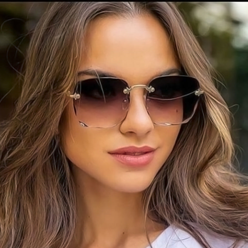 Woman wearing stylish sunglasses with gradient lenses outdoors
