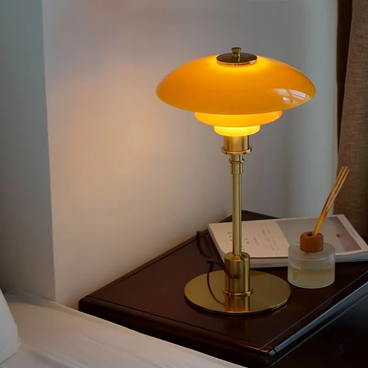 Minimalist Scandinavian LED table lamp glowing softly on a wooden desk