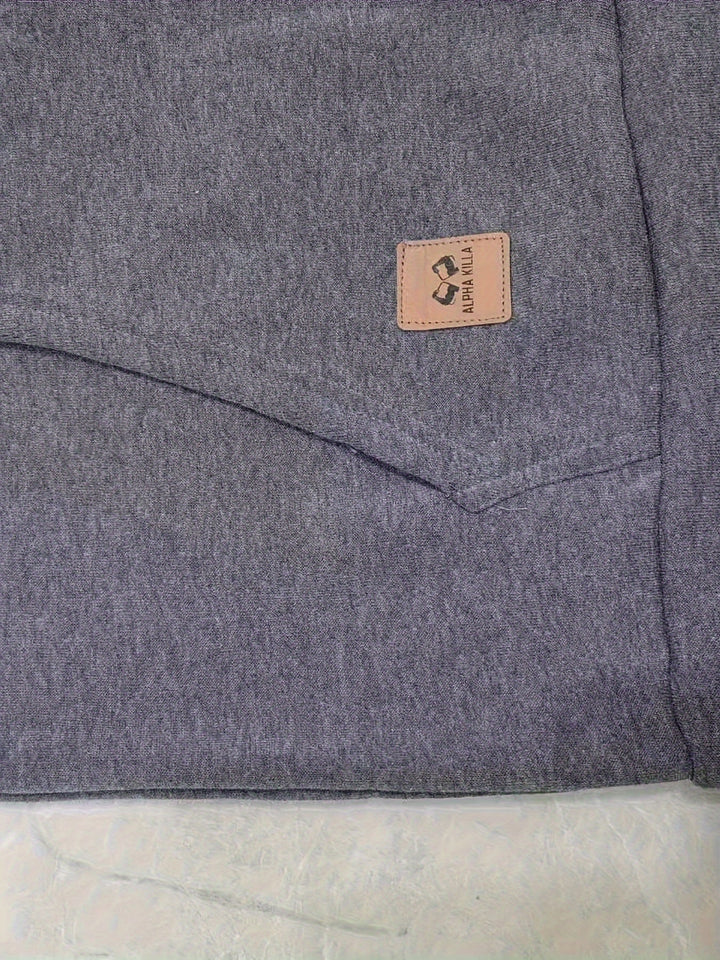Men's rugged quarter-zip hoodie displayed flat with modern casual accessories.