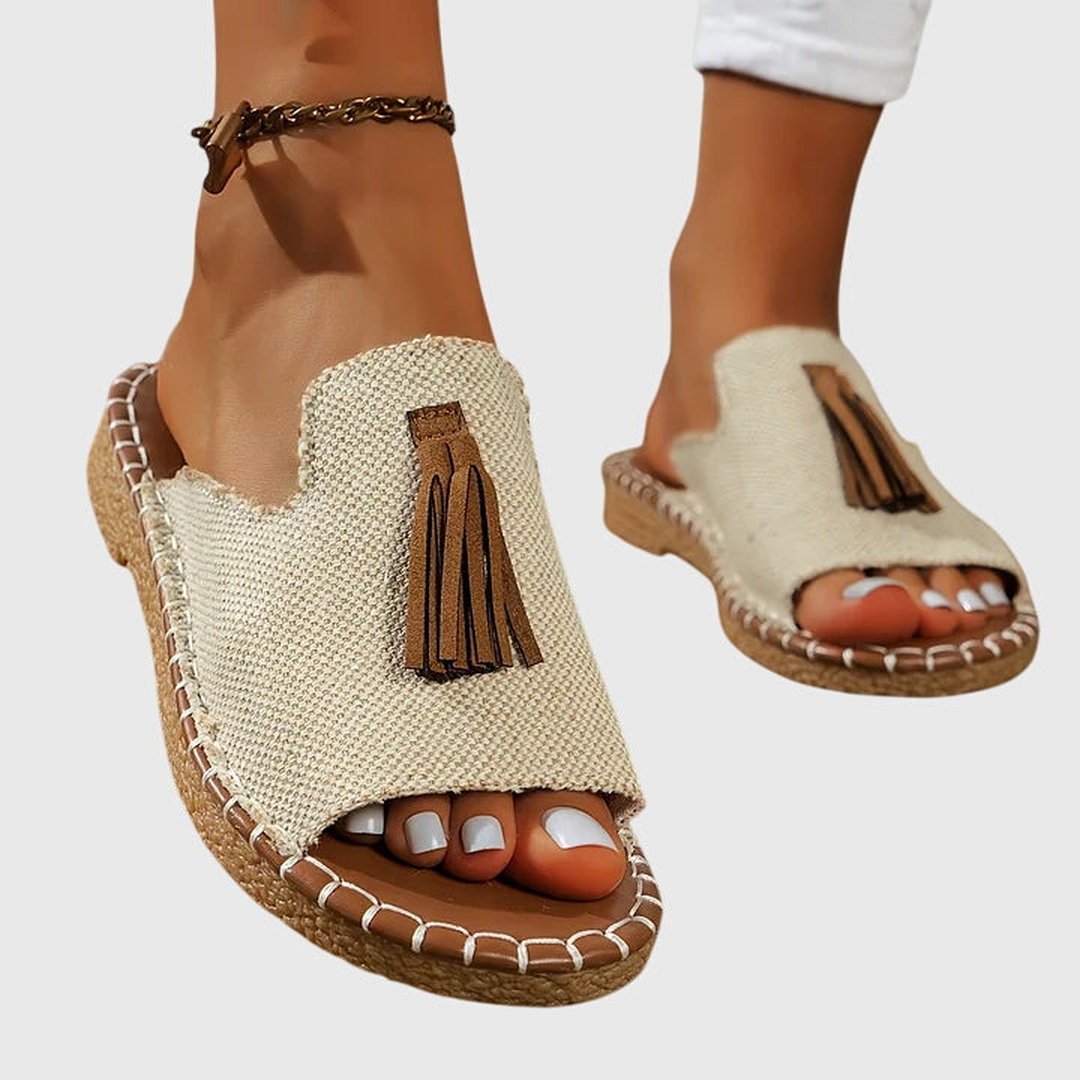 Pair of slip-on orthopedic sandals displayed on a clean white background