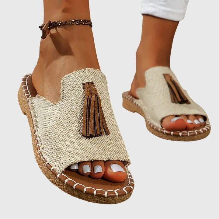 Pair of slip-on orthopedic sandals displayed on a clean white background