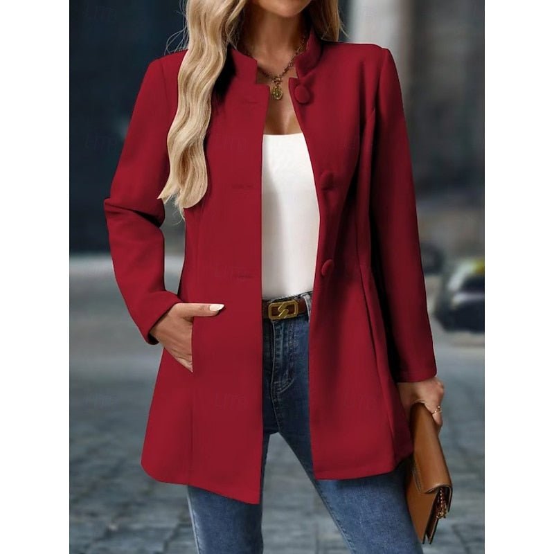 Close-up of the elegant stand collar and button details on women's coat