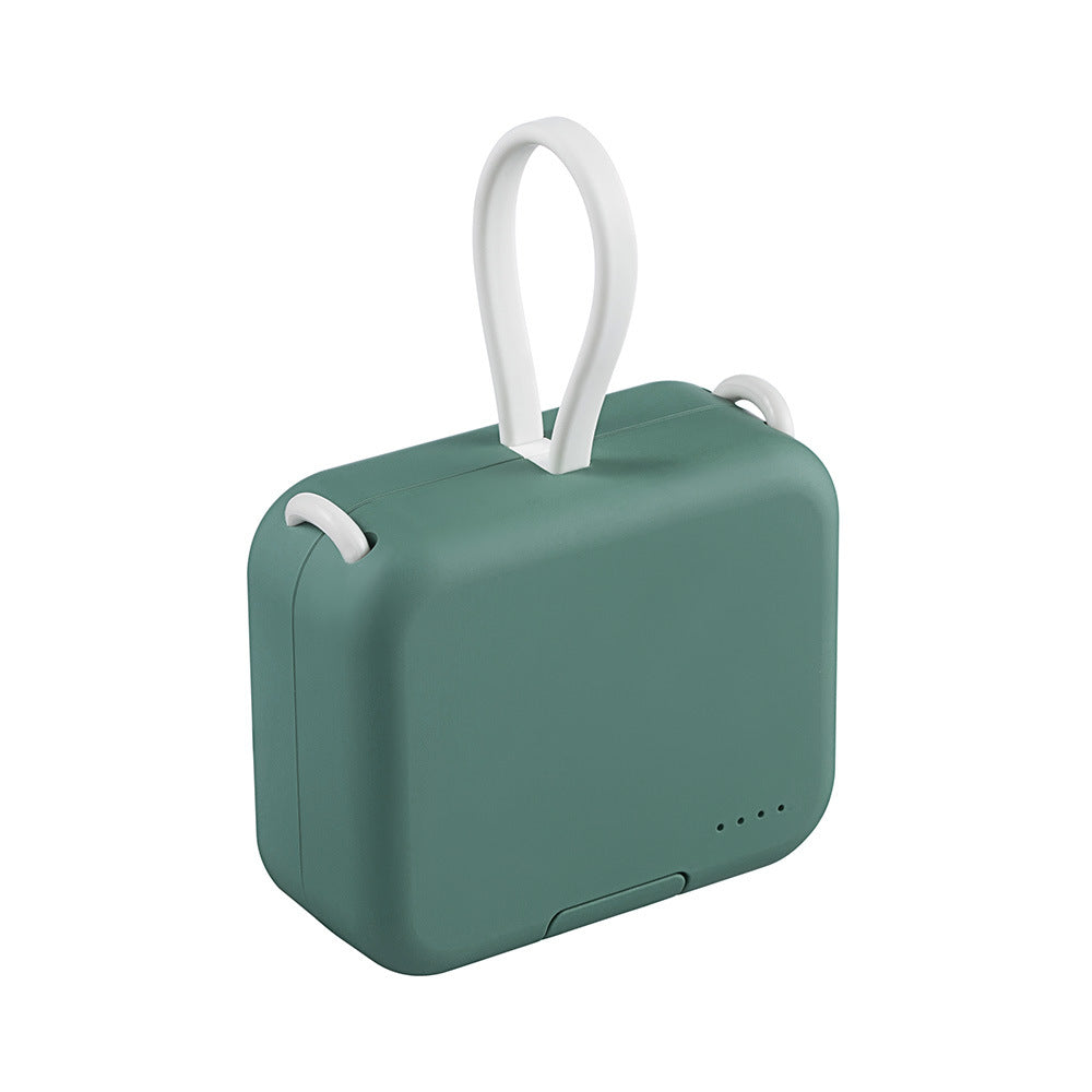 Compact green portable power bank with a white carrying loop
