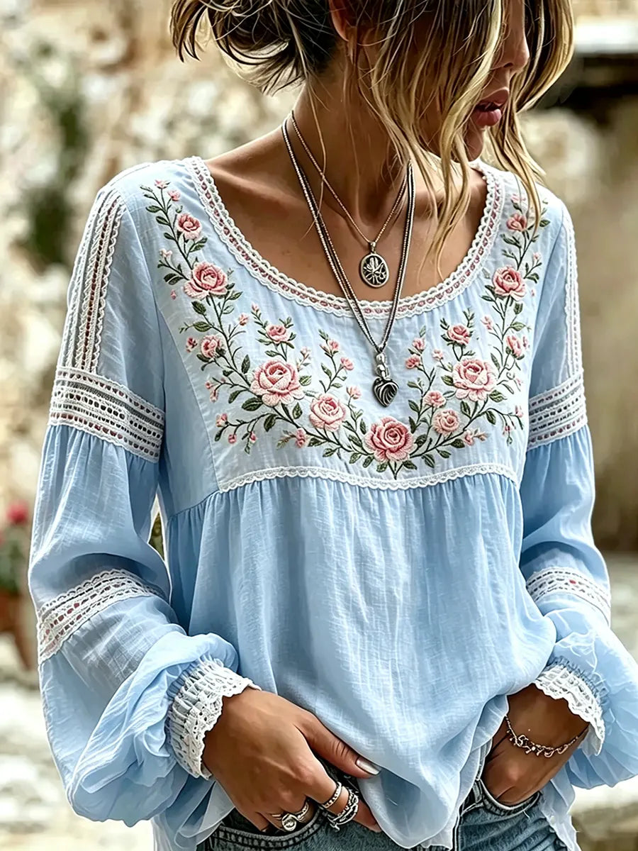 Womens floral embroidered long-sleeve blouse featuring intricate front detail and relaxed fit