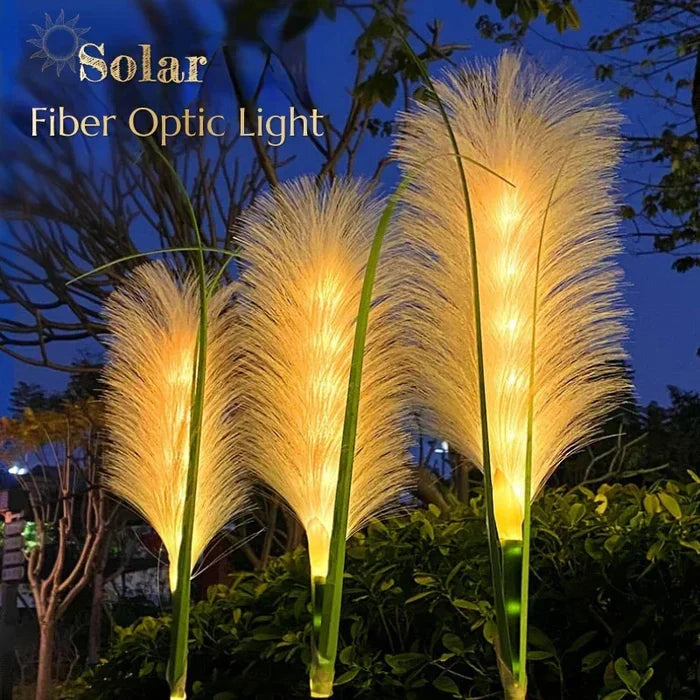 Solar fiber optic reed garden lamp lit up outdoors at dusk