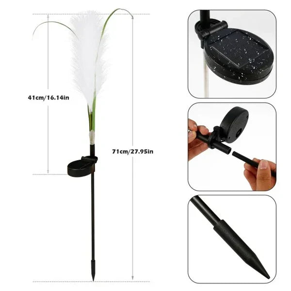 Yard accessories LED reed light staked in green grass during daytime
