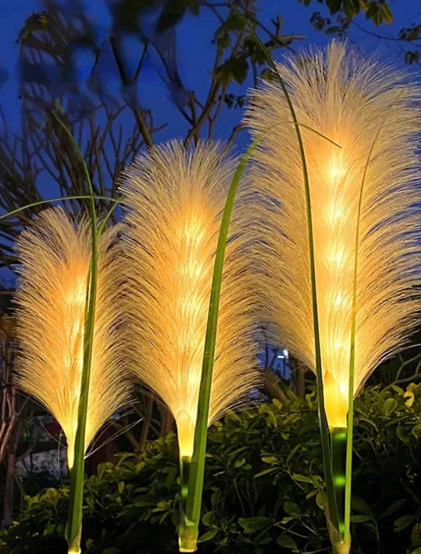 Decorative reed garden lighting glowing softly at night among foliage