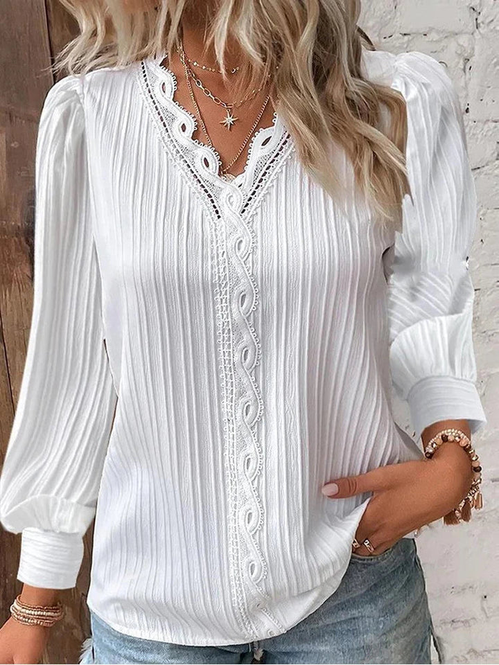 Detailed view of the ribbed texture on a women's long sleeve blouse