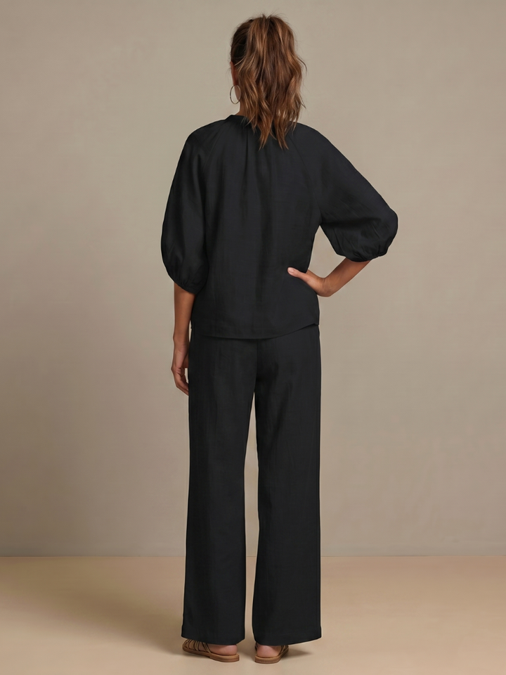 Detailed texture and drape of the fabric on the wide leg pants set