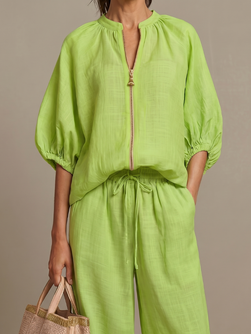 Elegant two-piece outfit with zip-front detailing and relaxed wide leg pants