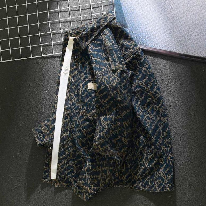 Close up of detailed script embroidery on back of blue denim jacket for men