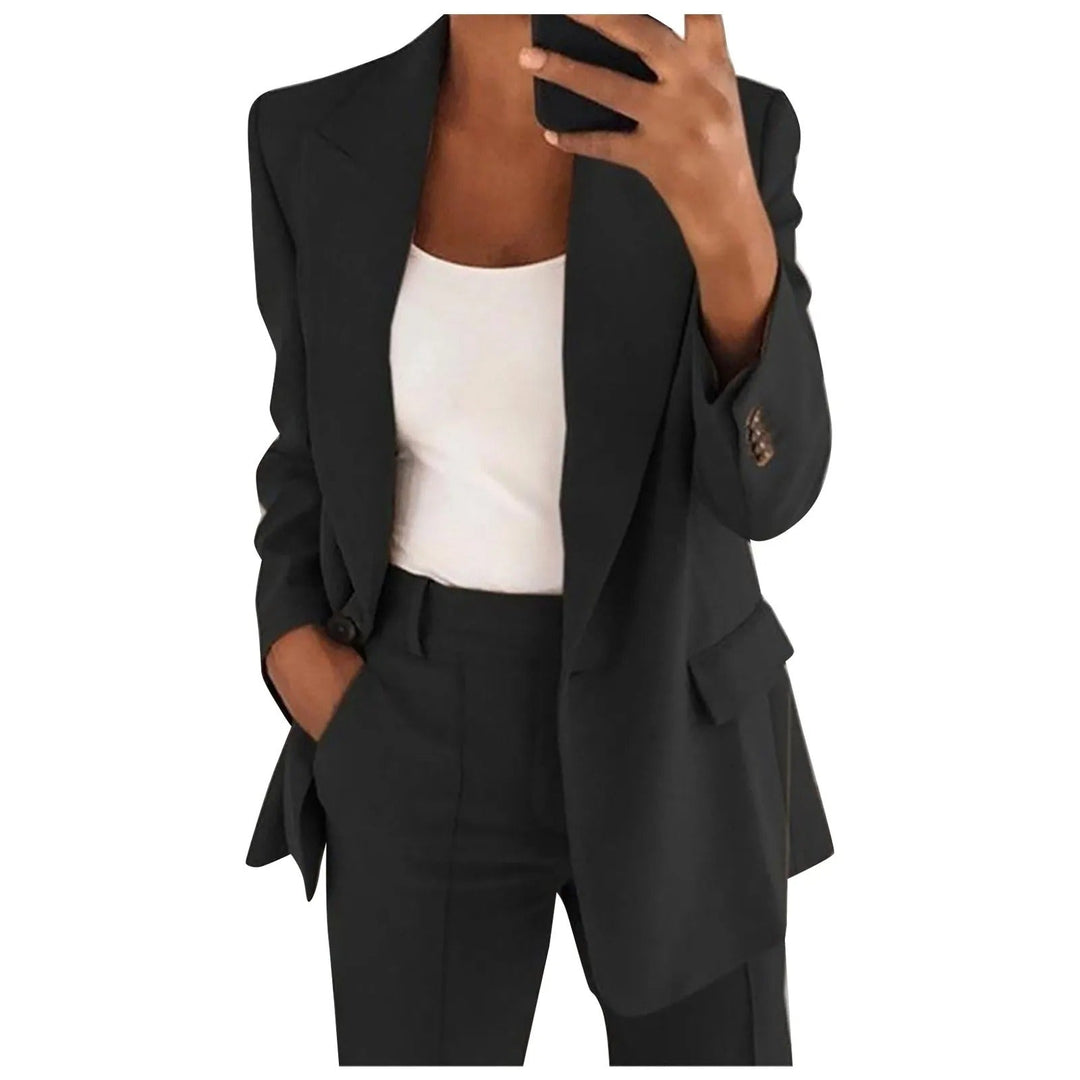Woman wearing black blazer and trousers two-piece suit set
