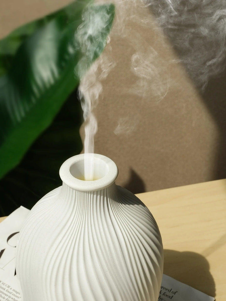 Close-up of BohoMist aroma diffuser top opening with mist