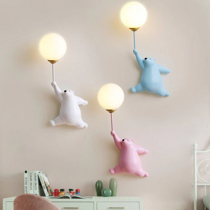 Charming bear LED wall lamp styled above a kids bed for cozy night lighting