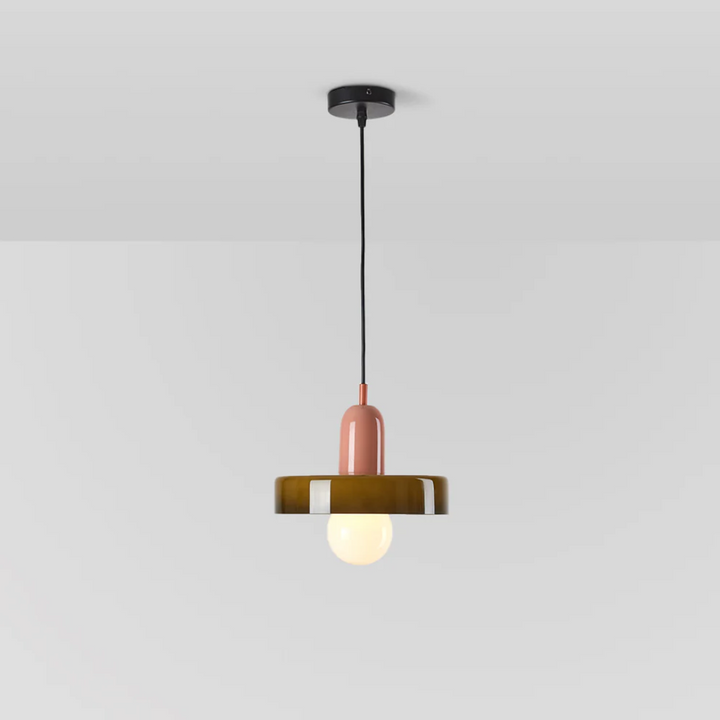 Modern LED pendant lamp casting a cozy glow over a seating area