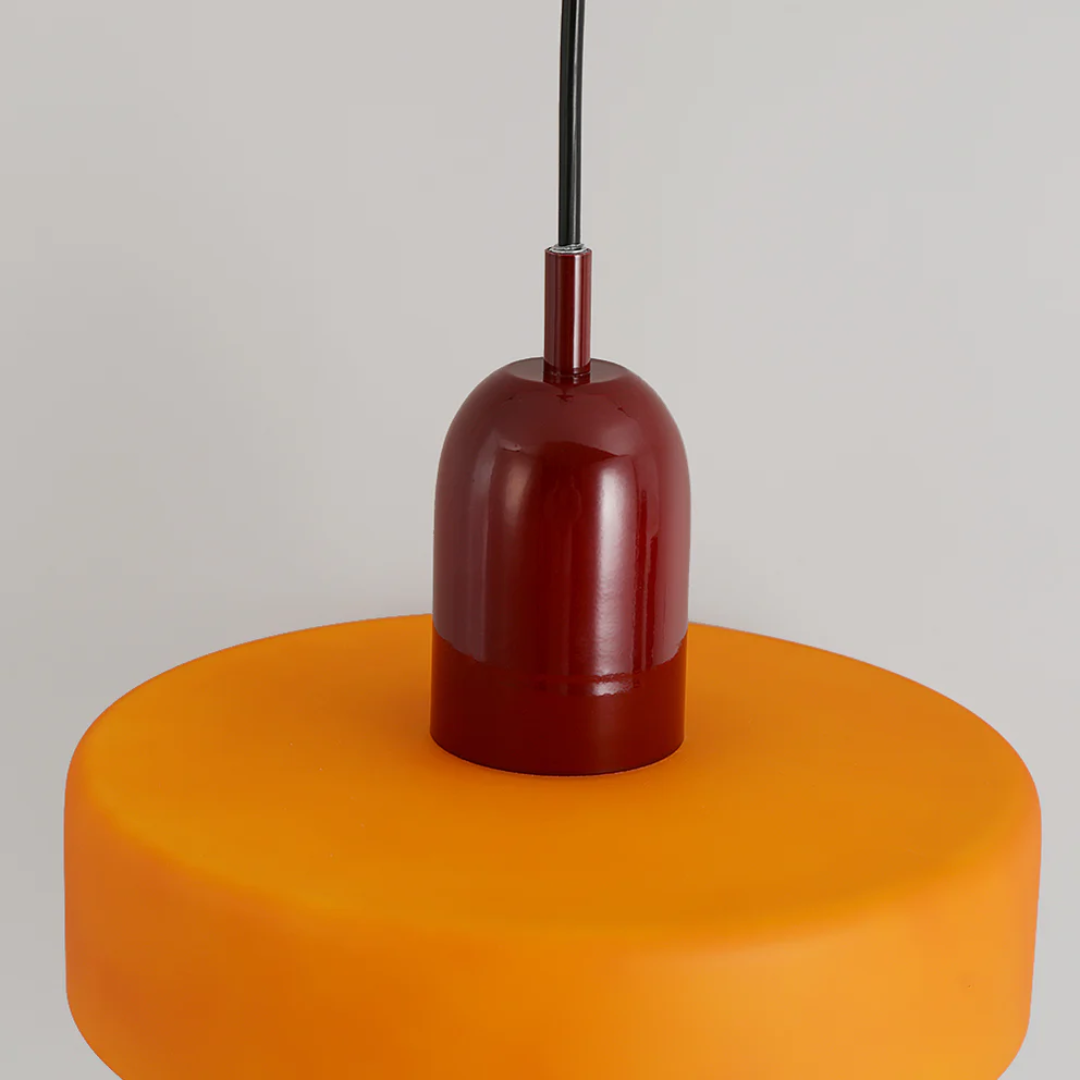 Sleek LED pendant lamp casting soft shadows on a neutral wall