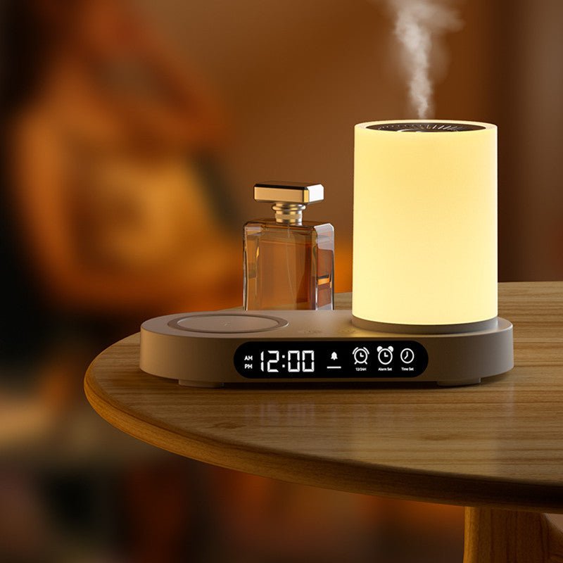 AromaGlow Luxe Desktop Diffuser in wood finish on a wooden table next to a perfume bottle