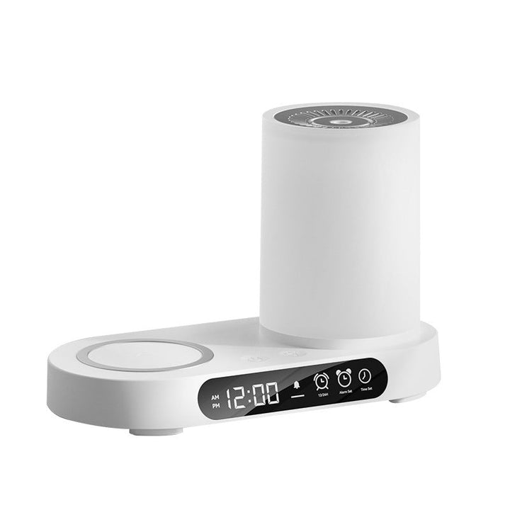 Compact ultrasonic humidifier and home fragrance diffuser glowing softly on a wooden desk