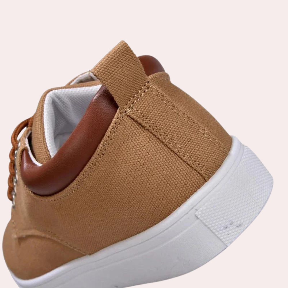 Angled lifestyle shot of mens fashion casual shoes worn outdoors