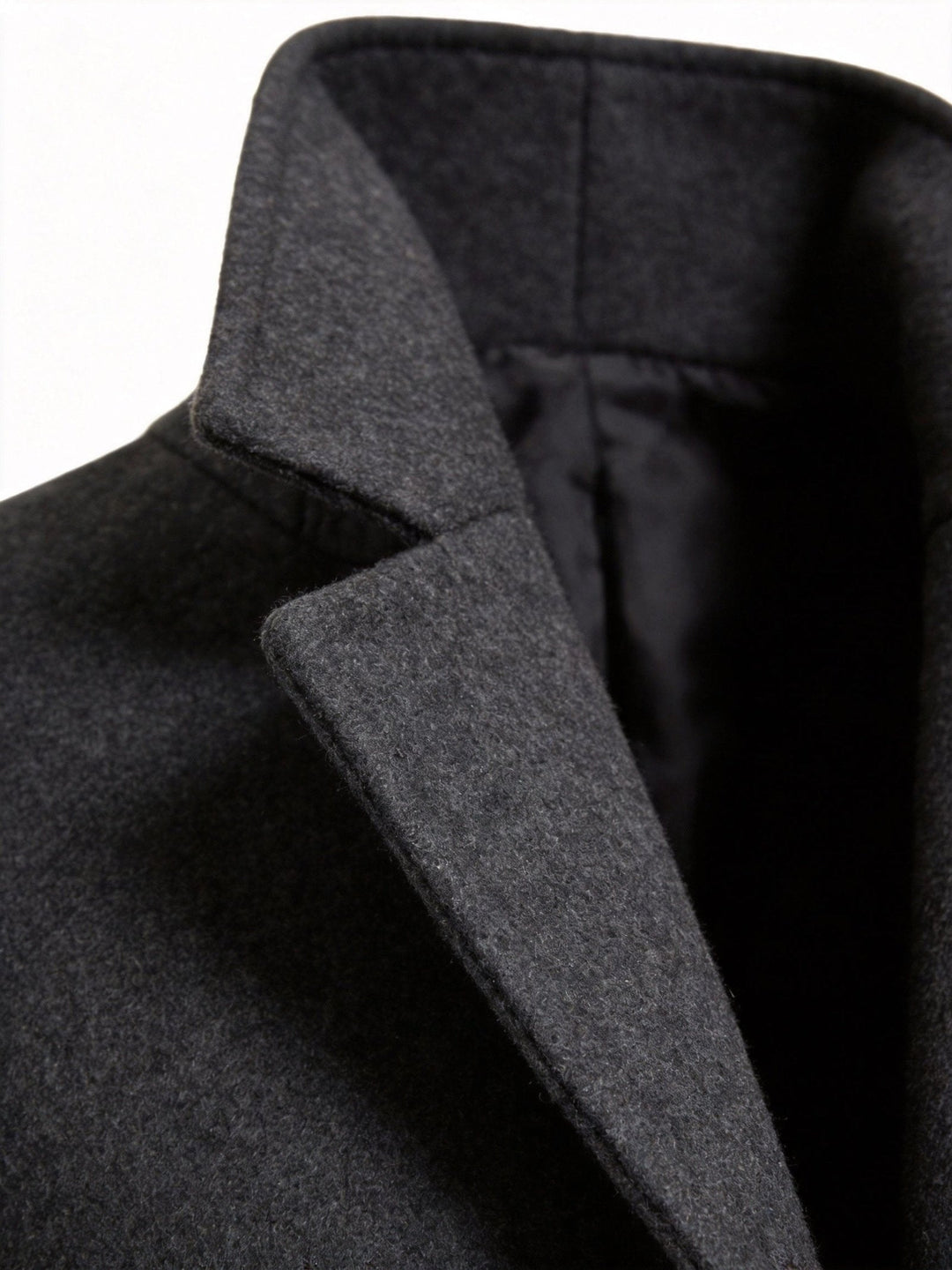 Overhead flat lay of the men's trench coat paired with accessories for a capsule wardrobe.