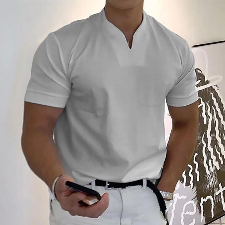 Detail view of the ribbed collar and button placket on the classic polo