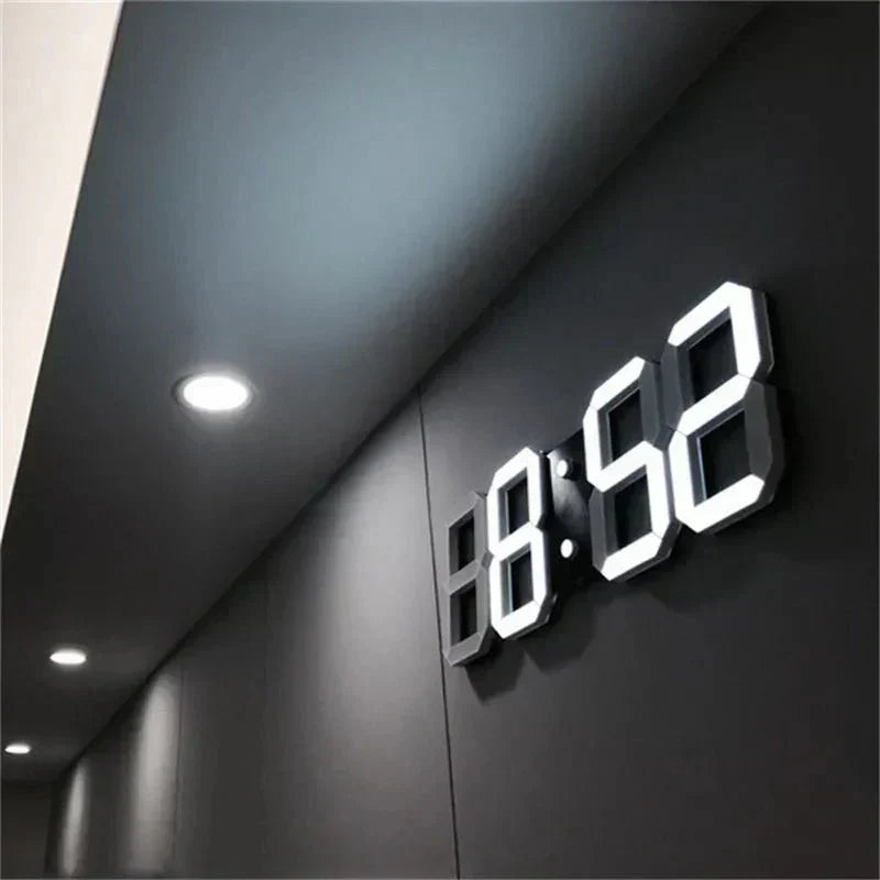 Modern digital 3D LED wall clock mounted on a dark wall showing time