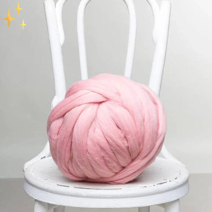 Close up of soft yarn loops during arm knitting process
