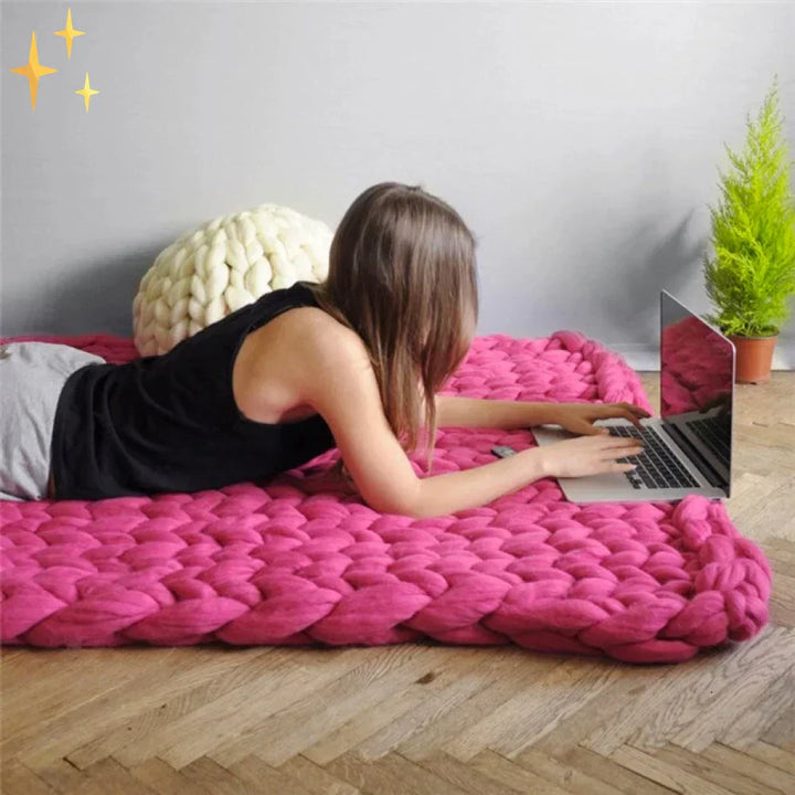 Cozy living space featuring a handmade bulky yarn throw blanket