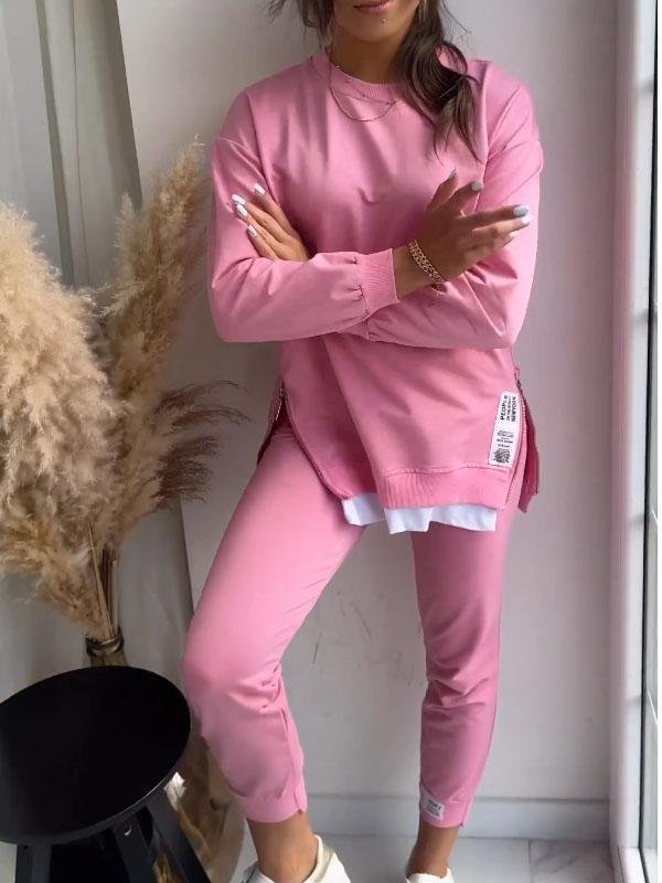 Close-up of woman in pink Marley loungewear showing relaxed top and fitted cuffs