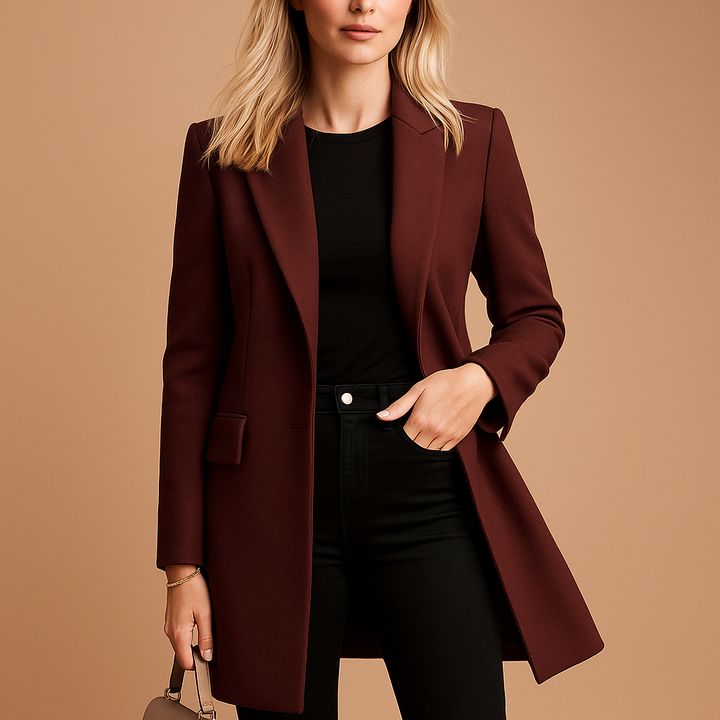 Model wearing a wine red fitted long trench coat with buttons