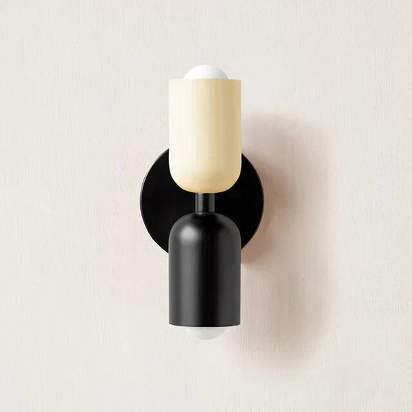 Illuminated dual light wall fixture mounted on a textured brick wall