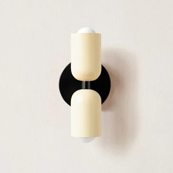 DualGlow double LED wall lamp with cream and black finish mounted on a neutral wall