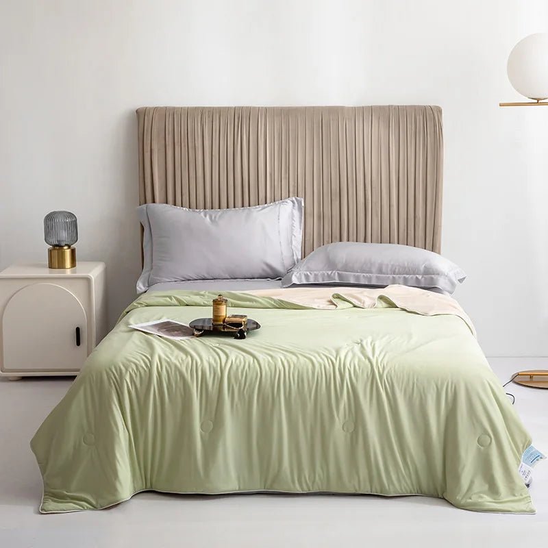 Fruit green lightweight cooling blanket draped elegantly on a made bed