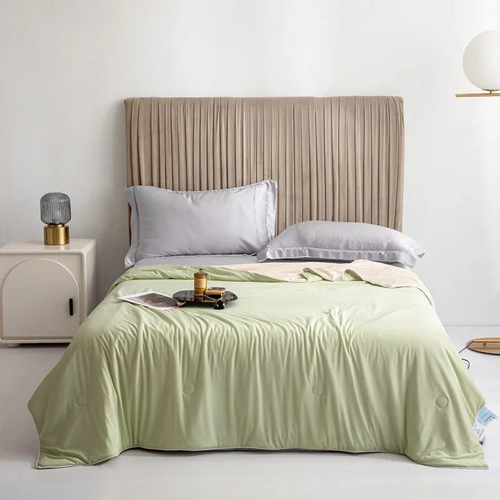 Fruit green lightweight cooling blanket draped elegantly on a made bed