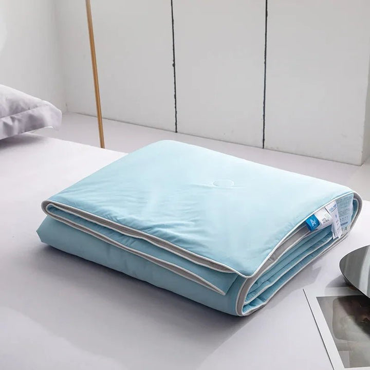 Stylized bedroom decor featuring a soft and cooling double-sided blanket