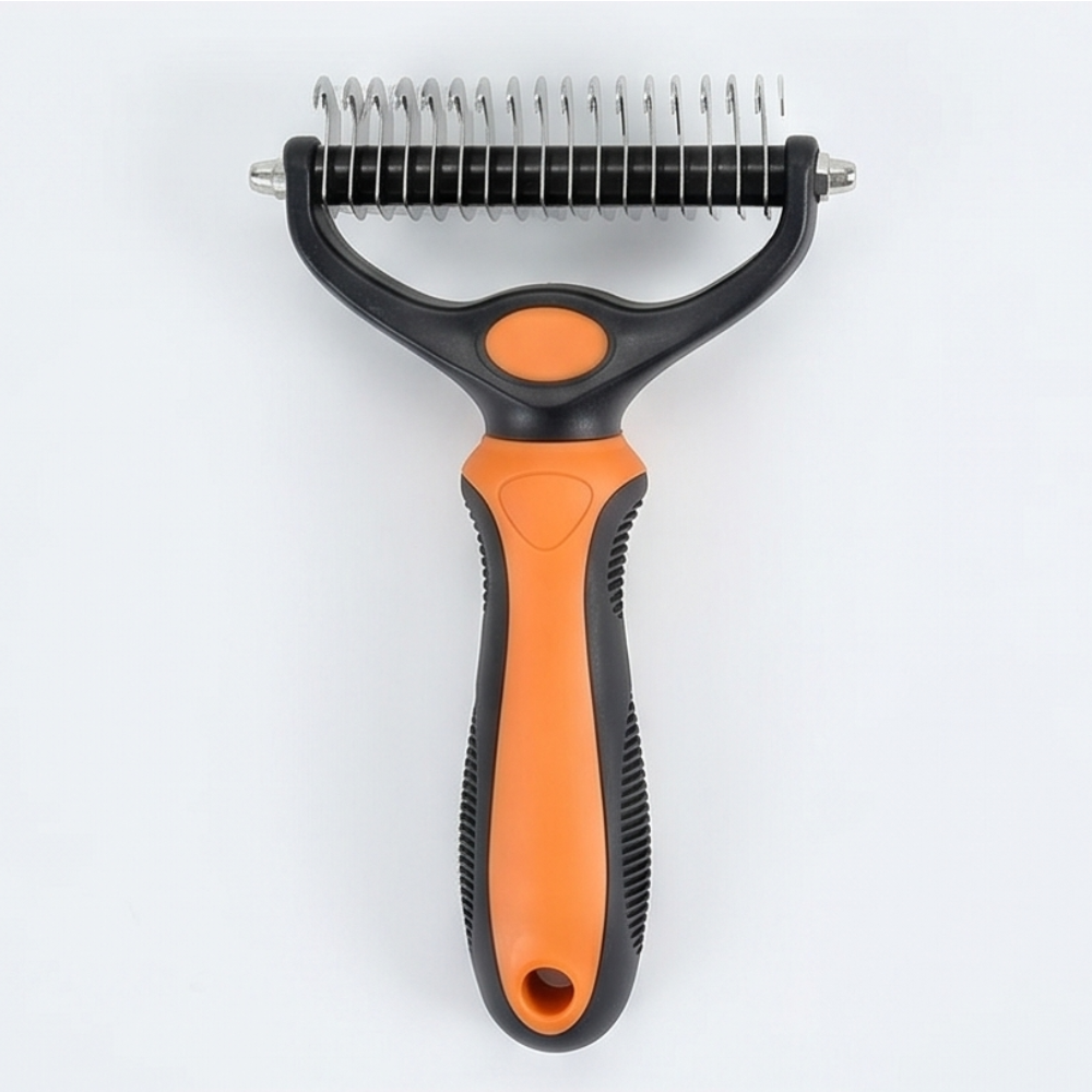 Orange double-sided dematting brush for dogs showing stainless steel teeth