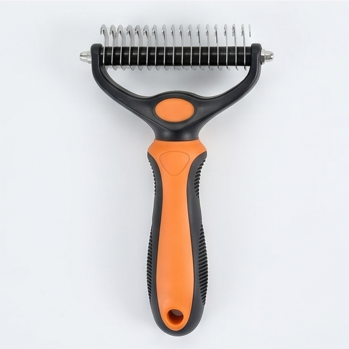 Orange double-sided dematting brush for dogs showing stainless steel teeth