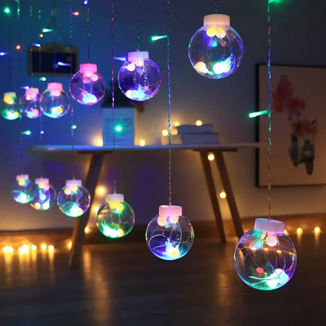 Colorful LED ball garland glowing indoors during an evening setup