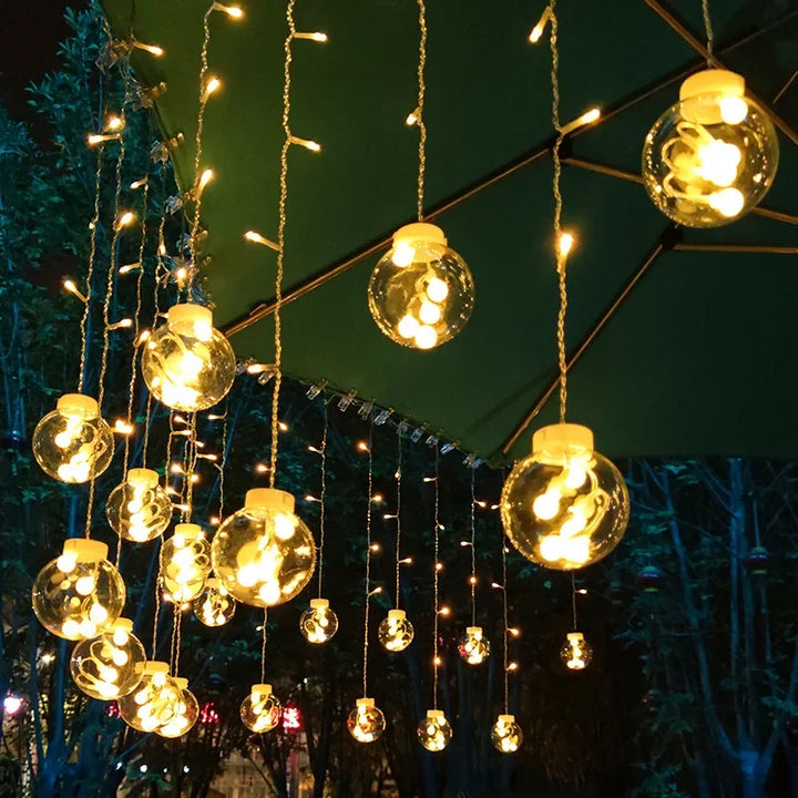 Waterproof outdoor string lights featuring glowing warm white globes