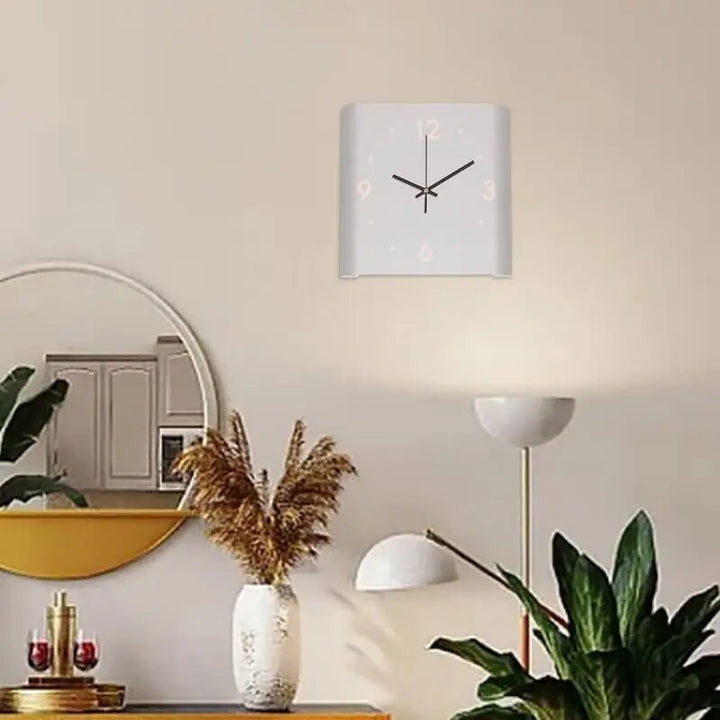 Minimalist double-sided square wall clock mounted on a neutral living room wall