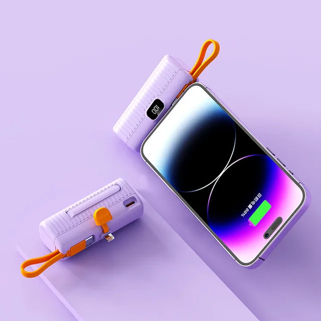USB-C charger power bank held in hand demonstrating pocket-sized design