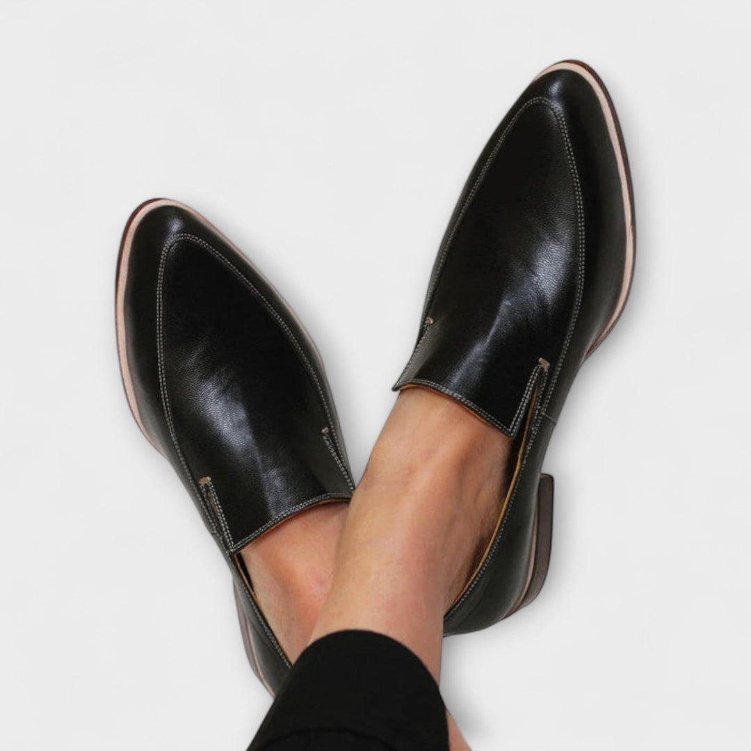 Women's black orthopaedic slip-on loafers shown from above