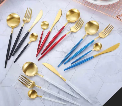 Stylish gold flatware set displayed on a modern dining table