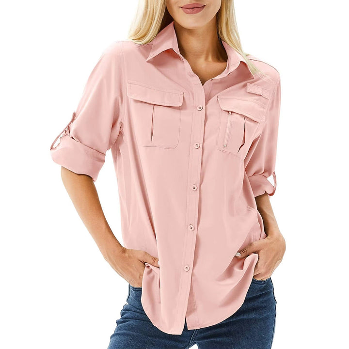 Woman wearing a pink long sleeve hiking shirt with dual chest pockets