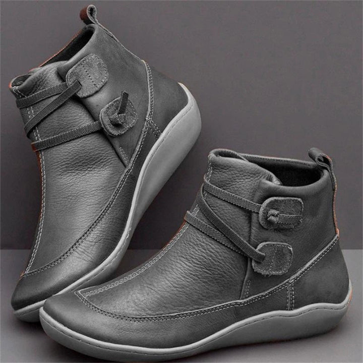 Gray women's orthopedic waterproof boots showcased from side angle