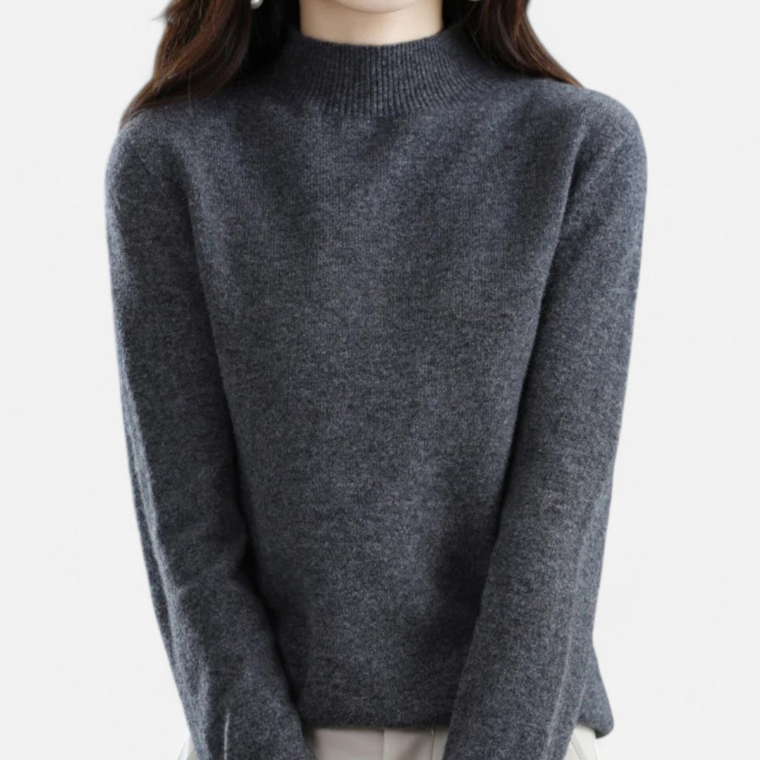 Close-up of women's dark grey mock neck knit sweater front view